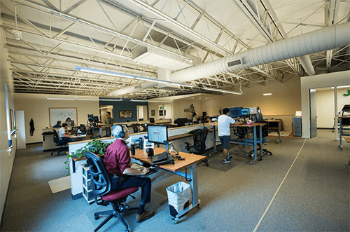 Image of developers working at their desks at Caktus